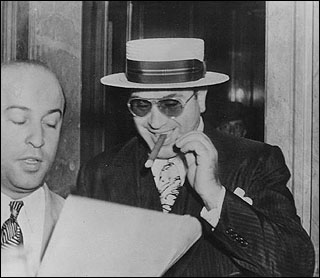 Capone consulting his lawyer